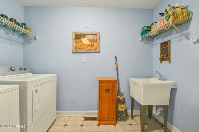 laundry area featuring washer and clothes dryer