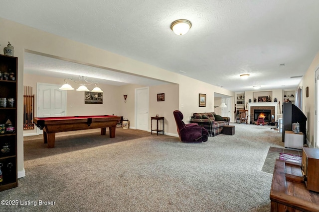 recreation room featuring built in shelves, billiards, carpet floors, and a textured ceiling