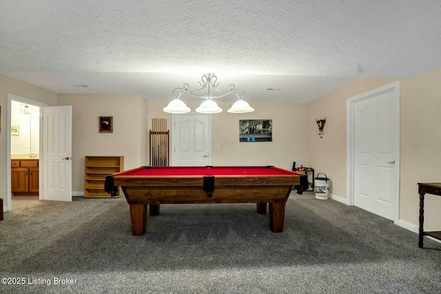 playroom featuring carpet, pool table, and a textured ceiling