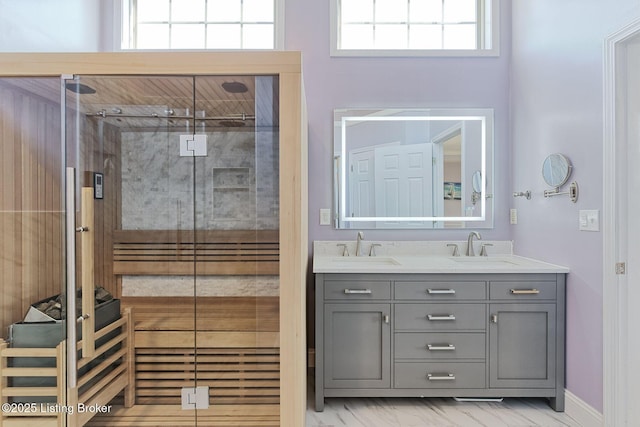 bathroom with vanity and a shower with shower door