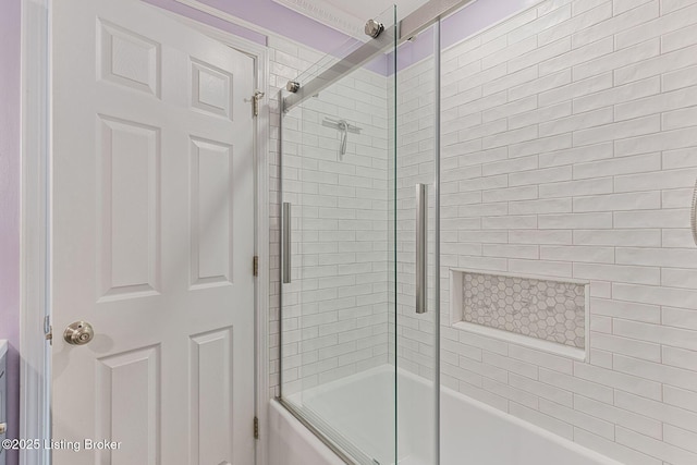 bathroom featuring enclosed tub / shower combo