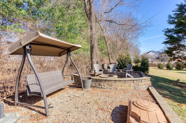 view of yard with an outdoor fire pit