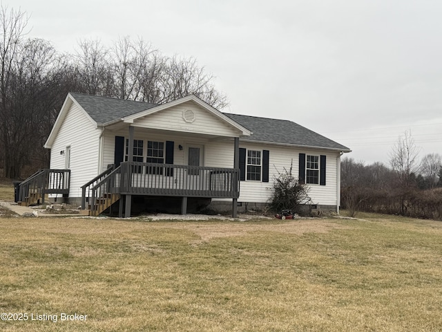 view of front of home featuring a wooden deck and a front lawn