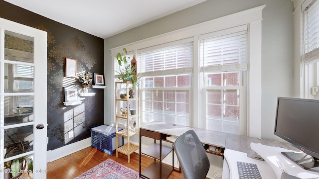 office with wood-type flooring and plenty of natural light