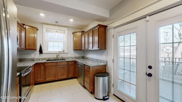 kitchen with french doors, sink, light stone counters, stainless steel dishwasher, and black range with electric stovetop