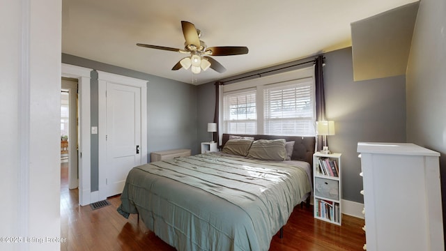 bedroom with hardwood / wood-style flooring and ceiling fan