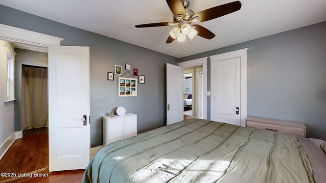 bedroom featuring dark wood-type flooring and ceiling fan