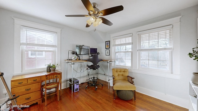 office with hardwood / wood-style flooring and ceiling fan