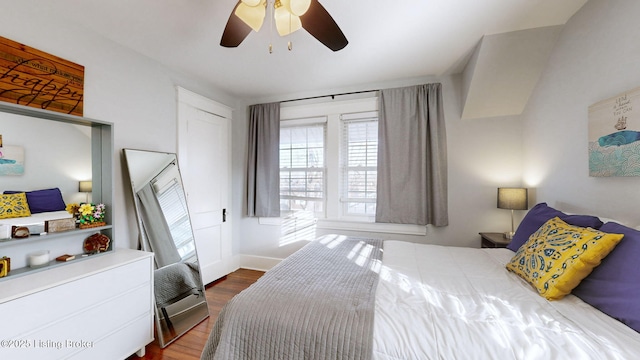 bedroom featuring ceiling fan and dark hardwood / wood-style floors