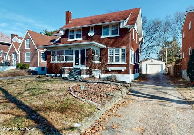 view of front of home with an outbuilding and a garage