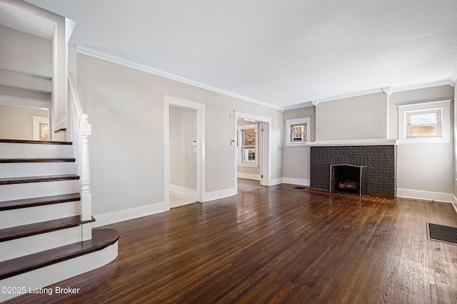 unfurnished living room with crown molding, a fireplace, and dark hardwood / wood-style floors