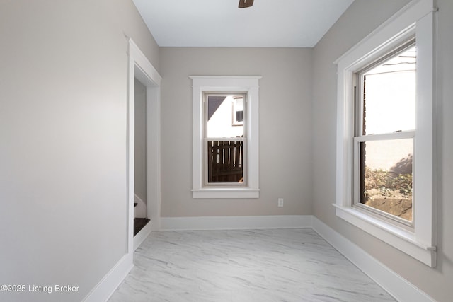 spare room with ceiling fan