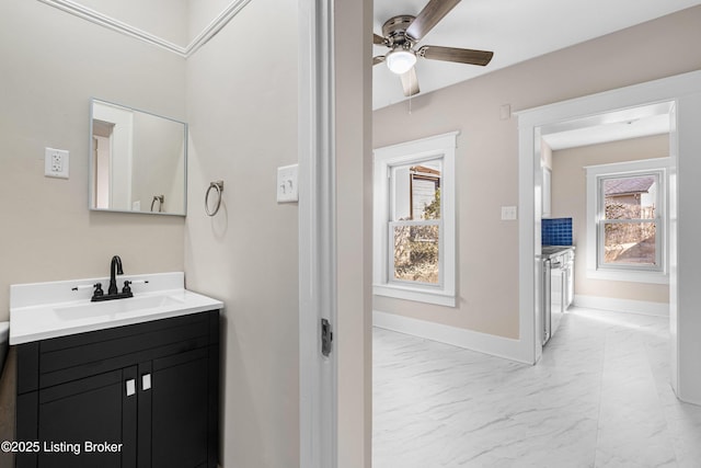 bathroom with ceiling fan and vanity