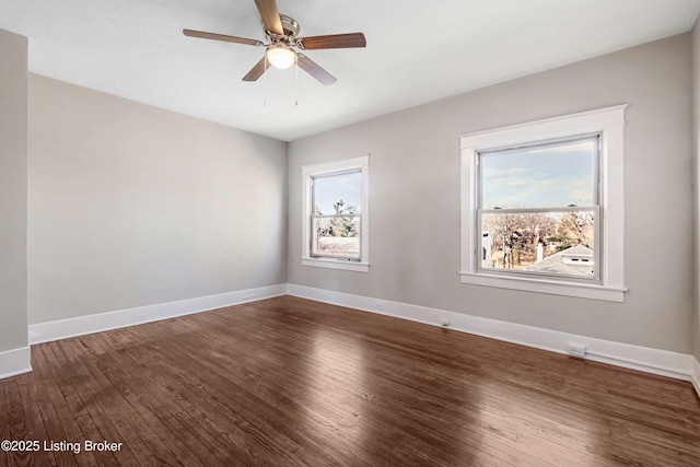 spare room with hardwood / wood-style flooring and ceiling fan