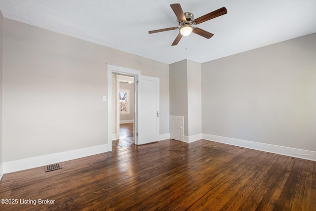 unfurnished room with dark wood-type flooring and ceiling fan