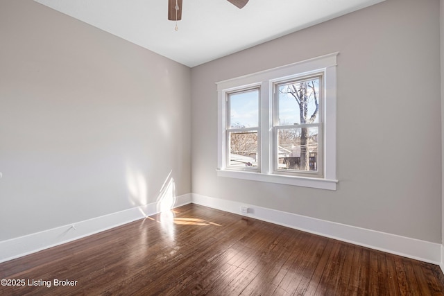 unfurnished room with hardwood / wood-style flooring and ceiling fan