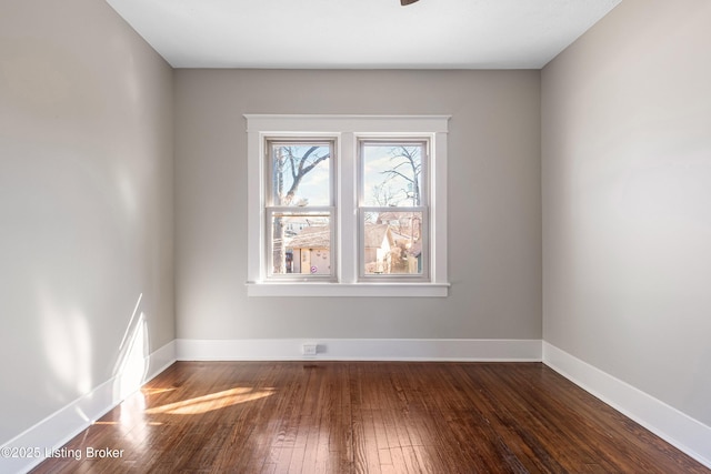 empty room featuring dark wood-type flooring