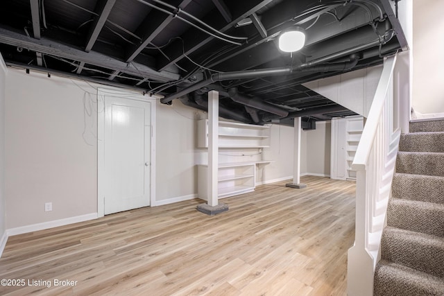 basement with wood-type flooring