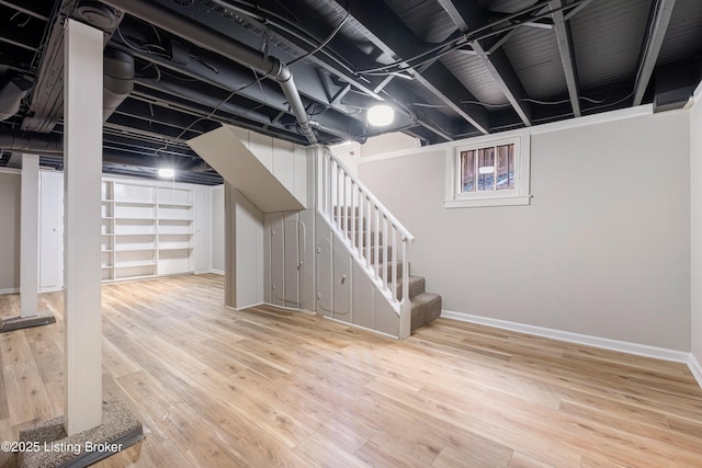 basement featuring hardwood / wood-style floors