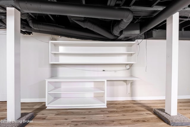 basement featuring hardwood / wood-style flooring