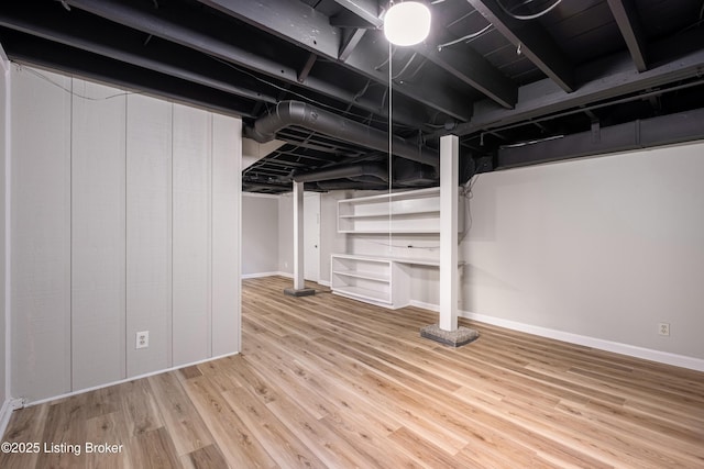 basement featuring hardwood / wood-style flooring