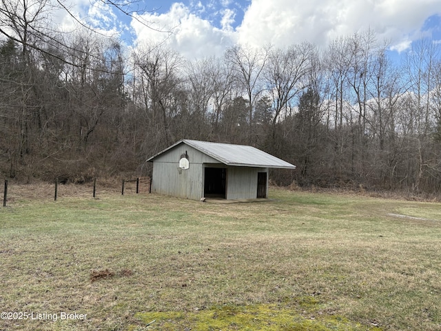 view of outbuilding with a yard