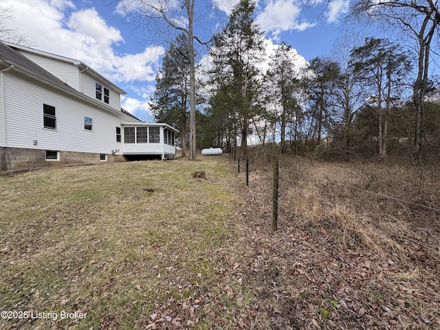 view of yard with a sunroom