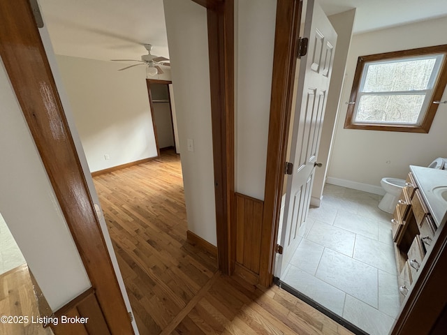 hall with light hardwood / wood-style flooring