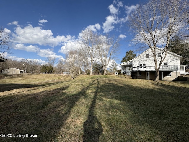 view of yard featuring a wooden deck