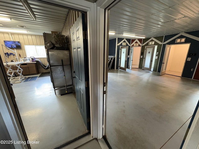 hallway with concrete flooring