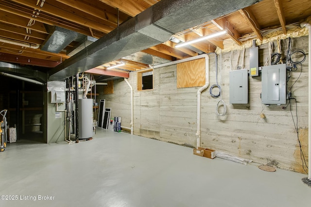 basement featuring electric panel and gas water heater