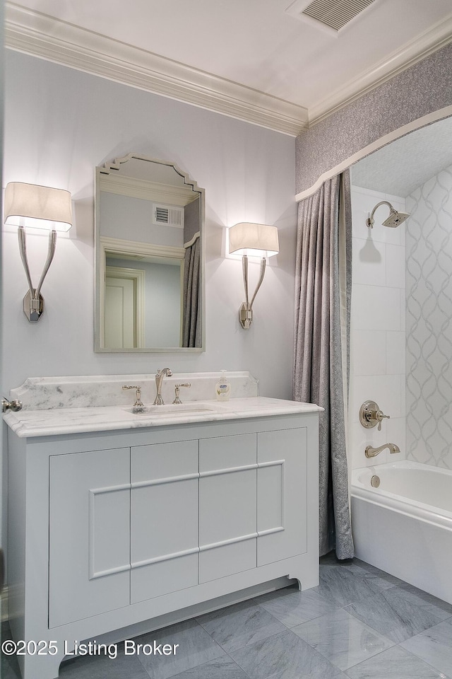 bathroom featuring ornamental molding, shower / bath combo with shower curtain, and vanity