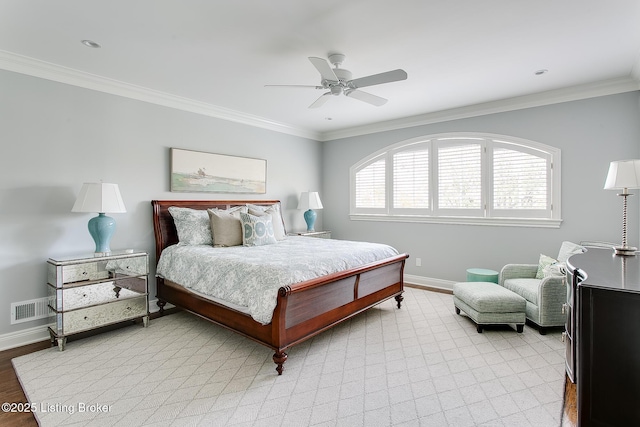 bedroom featuring crown molding, ceiling fan, and light hardwood / wood-style flooring