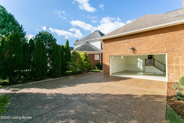 view of property exterior with a garage