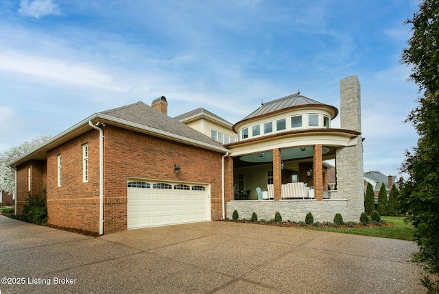 view of front of home with a garage and covered porch