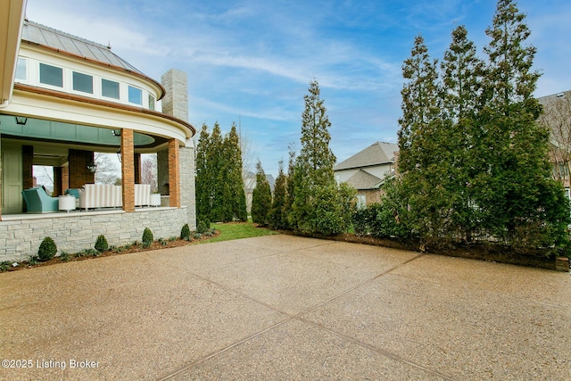 view of side of property featuring a patio area