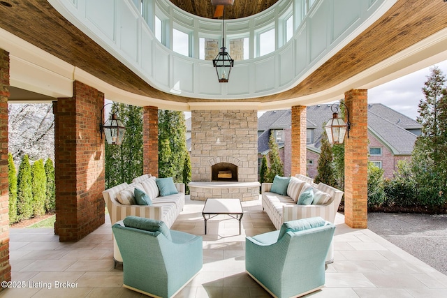 view of patio / terrace featuring an outdoor living space with a fireplace