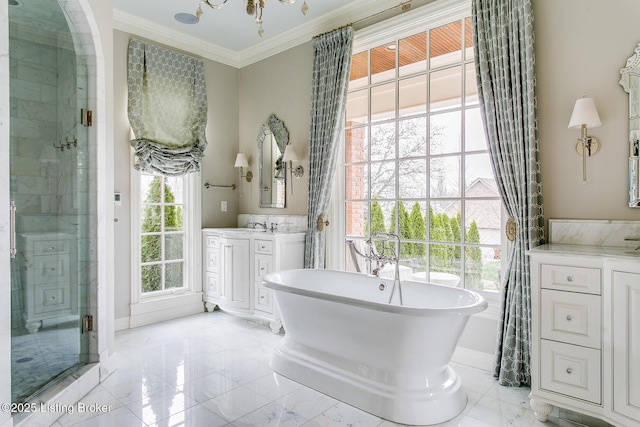 bathroom with vanity, ornamental molding, and plus walk in shower