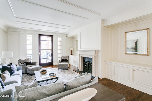 living room featuring ornamental molding and dark hardwood / wood-style floors