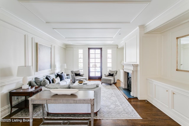 living room featuring ornamental molding and dark hardwood / wood-style floors