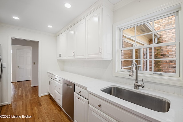 kitchen featuring white cabinetry, stainless steel dishwasher, dark wood-type flooring, and sink