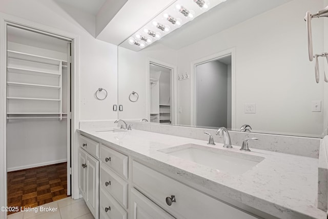 bathroom with vanity and tile patterned flooring