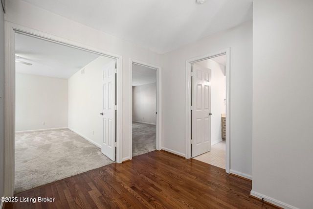 hallway featuring dark hardwood / wood-style floors