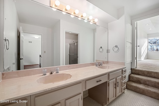 bathroom with vanity and an enclosed shower