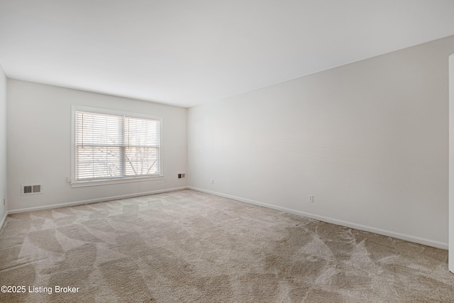 empty room featuring light carpet