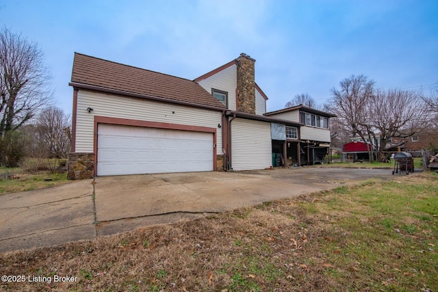 view of side of home featuring a garage