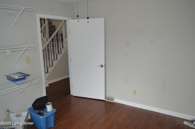 spare room featuring dark hardwood / wood-style floors