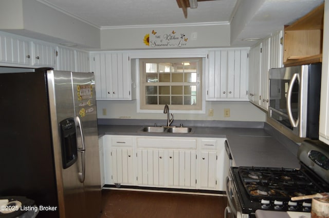 kitchen featuring white cabinetry, sink, stainless steel appliances, crown molding, and dark wood-type flooring