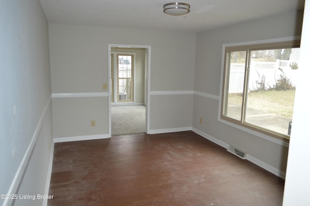 empty room featuring dark hardwood / wood-style flooring