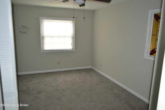 carpeted empty room with ceiling fan